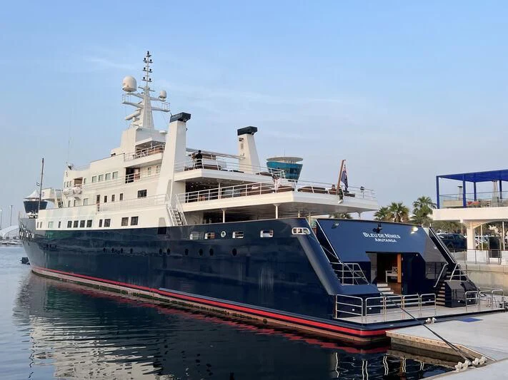 a large ship docked aboard BLEU DE NIMES Yacht for Charter
