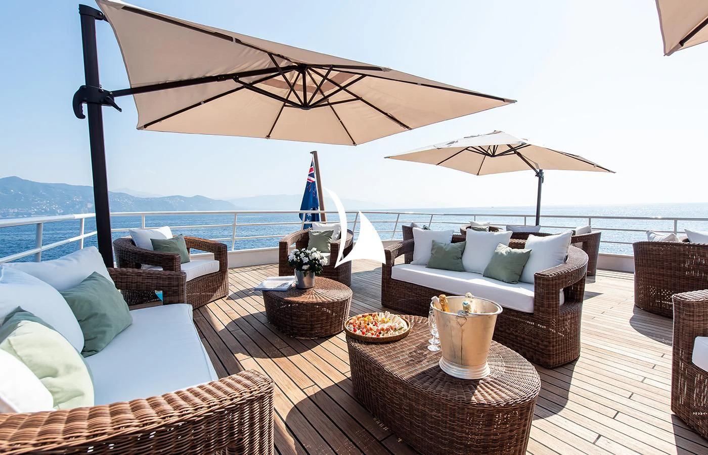a patio with a table and chairs aboard BLEU DE NIMES Yacht for Charter
