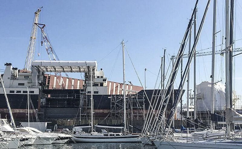 a large ship docked aboard BLEU DE NIMES Yacht for Charter