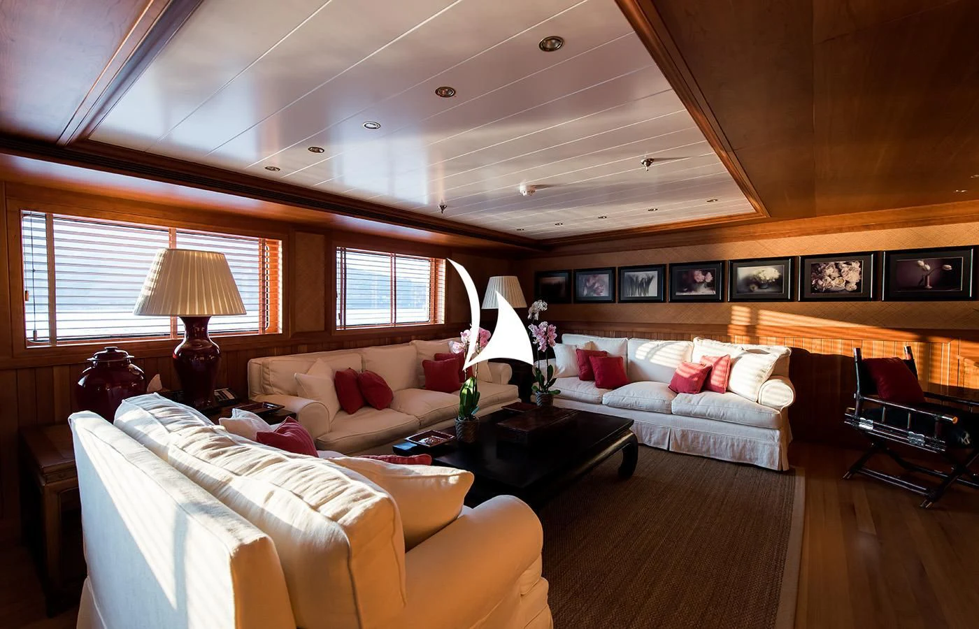 a living room with a couch and a table aboard BLEU DE NIMES Yacht for Charter
