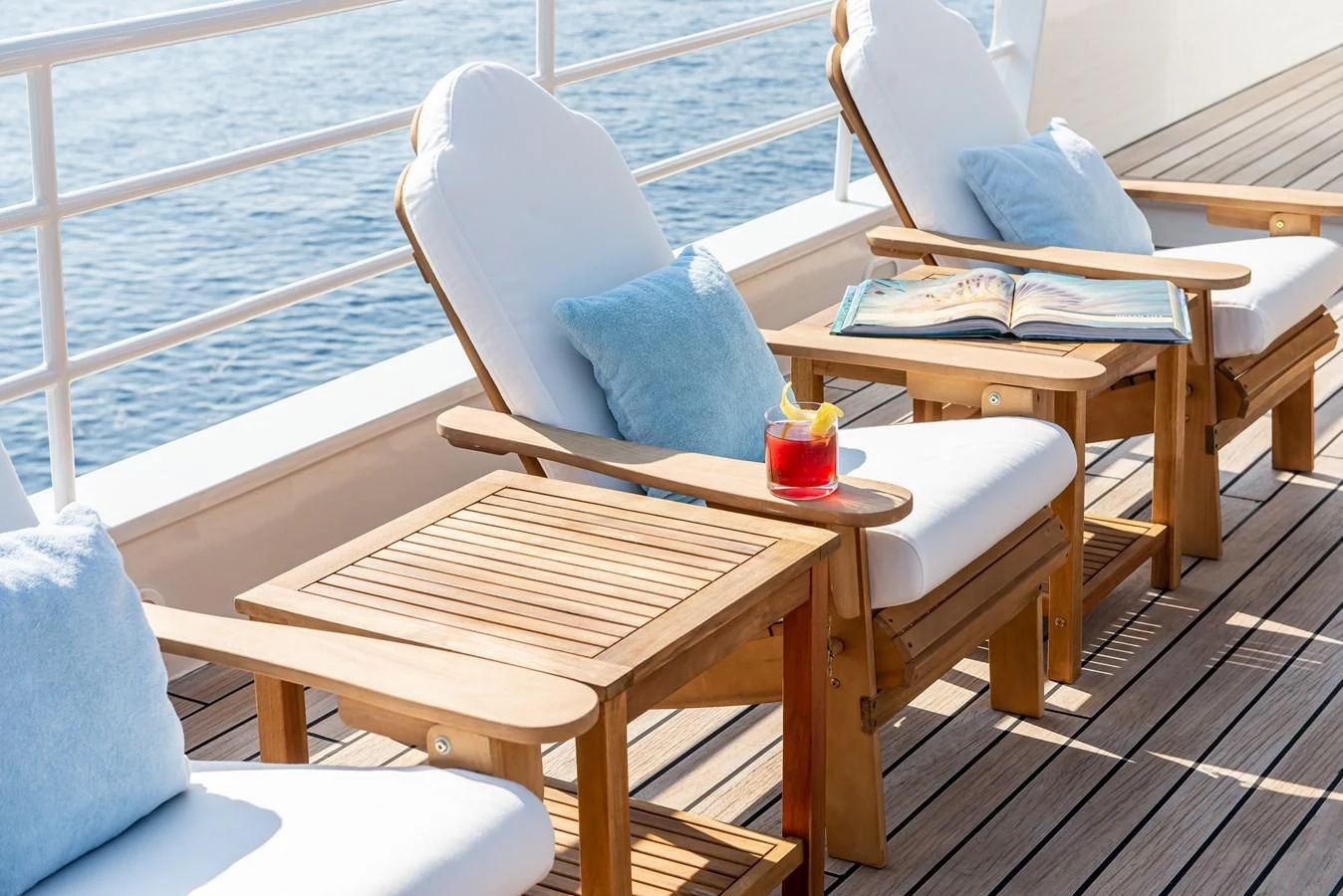 a table with chairs on it aboard BLEU DE NIMES Yacht for Charter