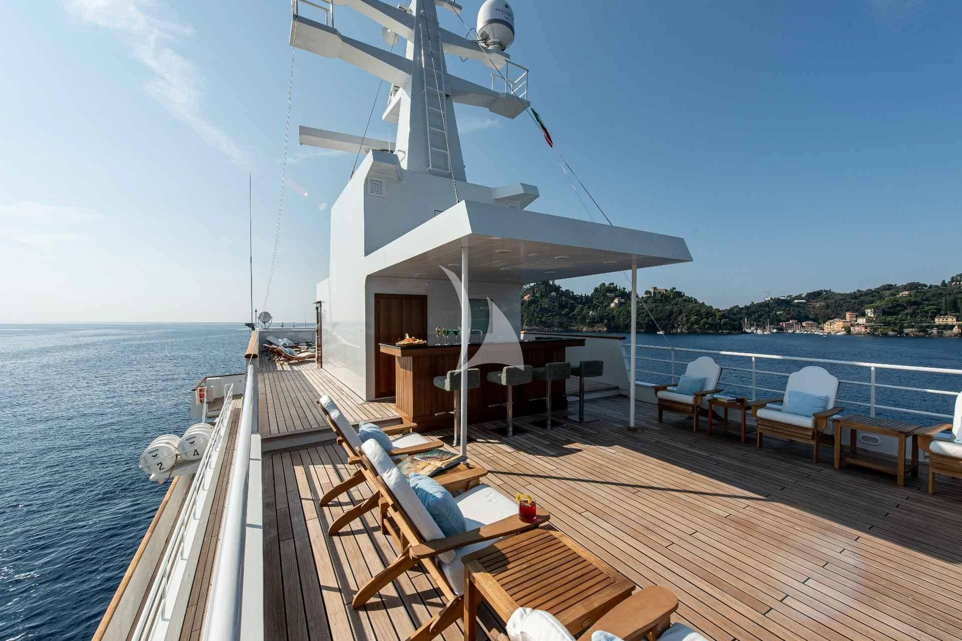 a boat dock with chairs and tables on it aboard BLEU DE NIMES Yacht for Charter