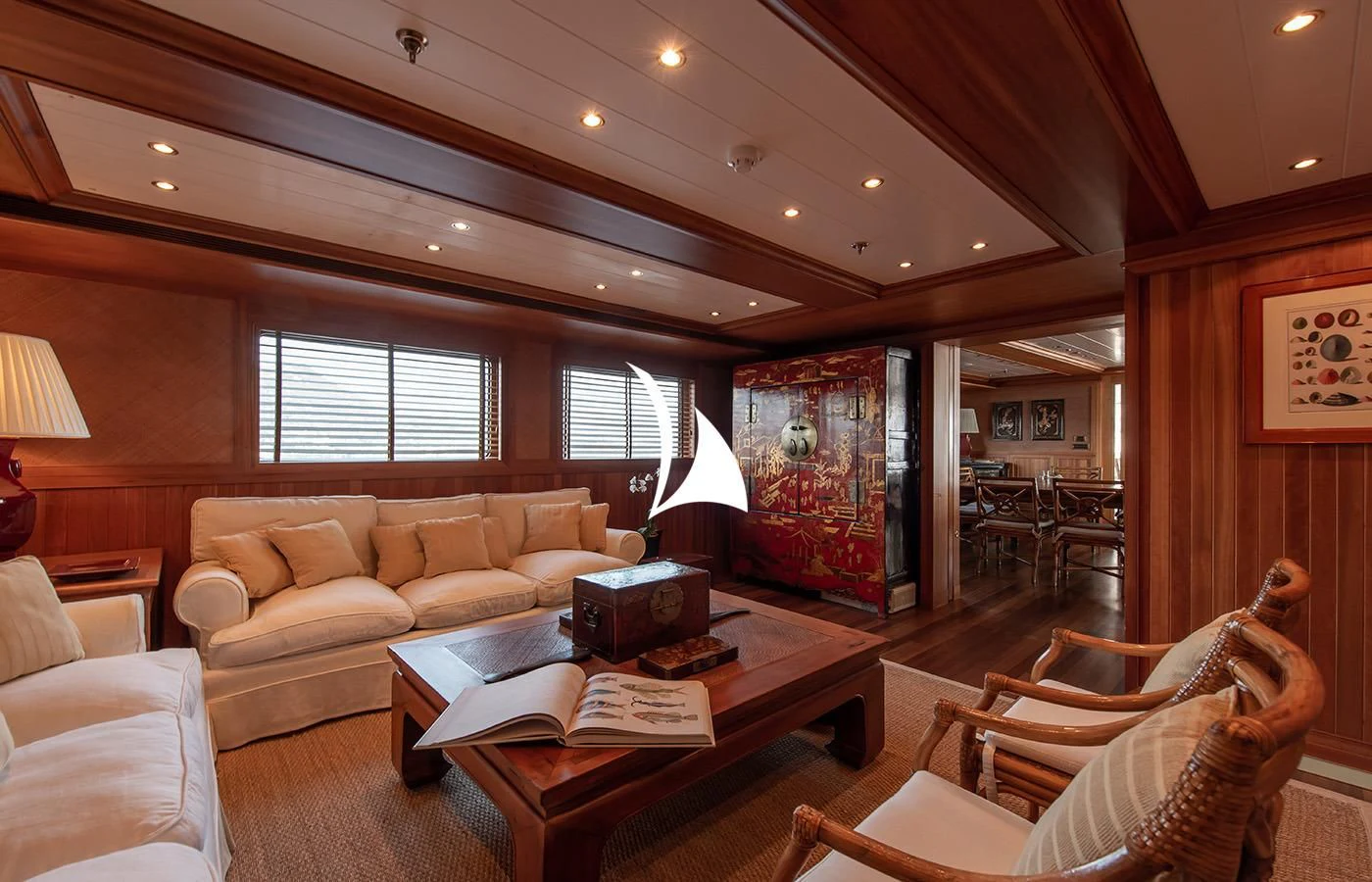 a living room with a table and chairs aboard BLEU DE NIMES Yacht for Charter