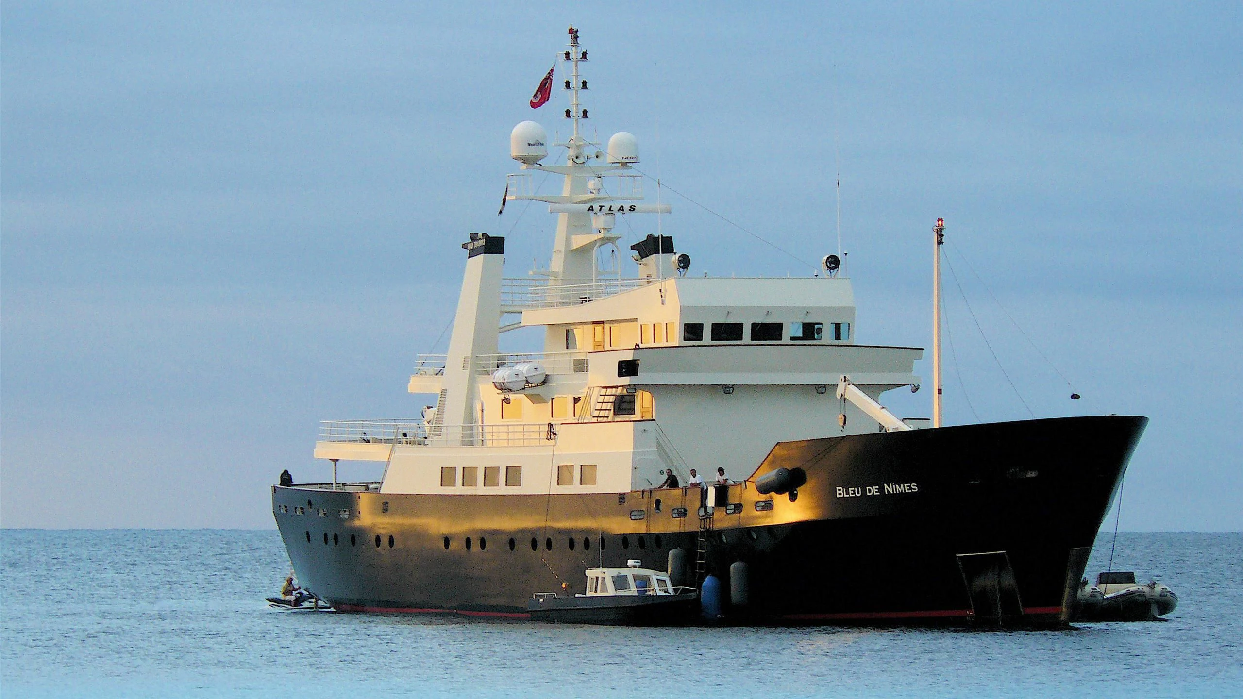 a large ship in the water aboard BLEU DE NIMES Yacht for Charter