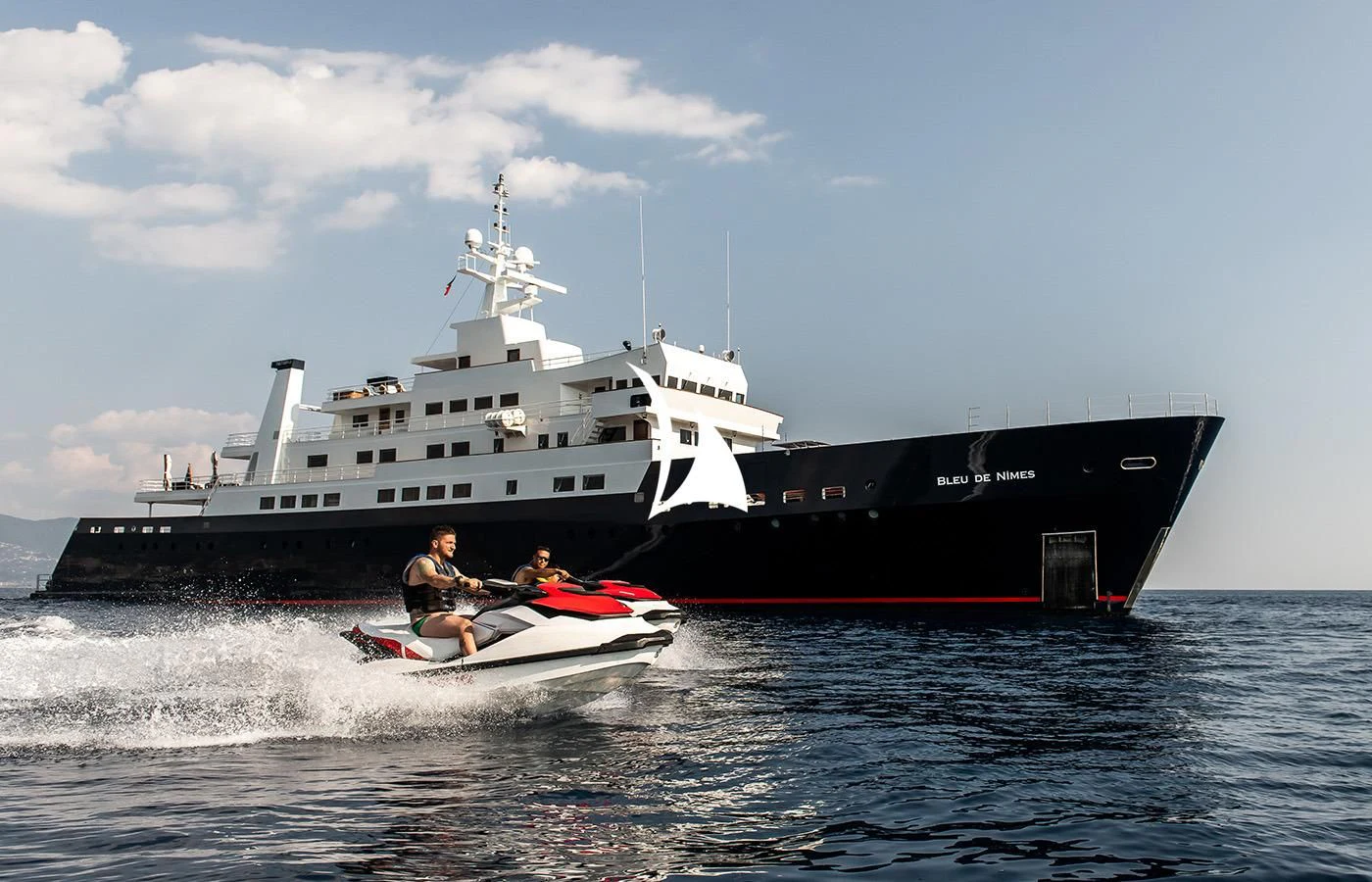 a boat on the water aboard BLEU DE NIMES Yacht for Charter