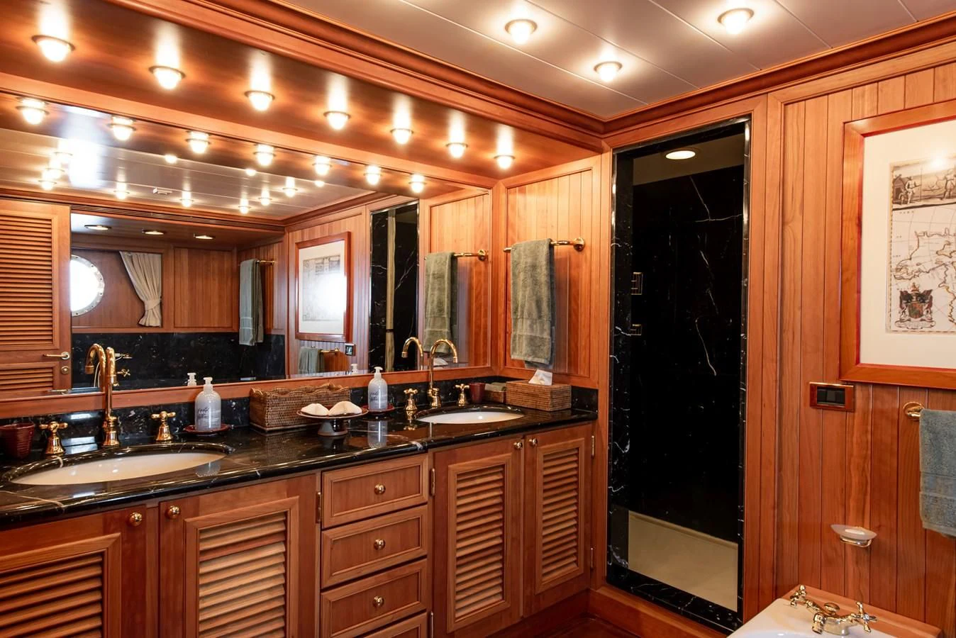 a bathroom with a large mirror aboard BLEU DE NIMES Yacht for Charter