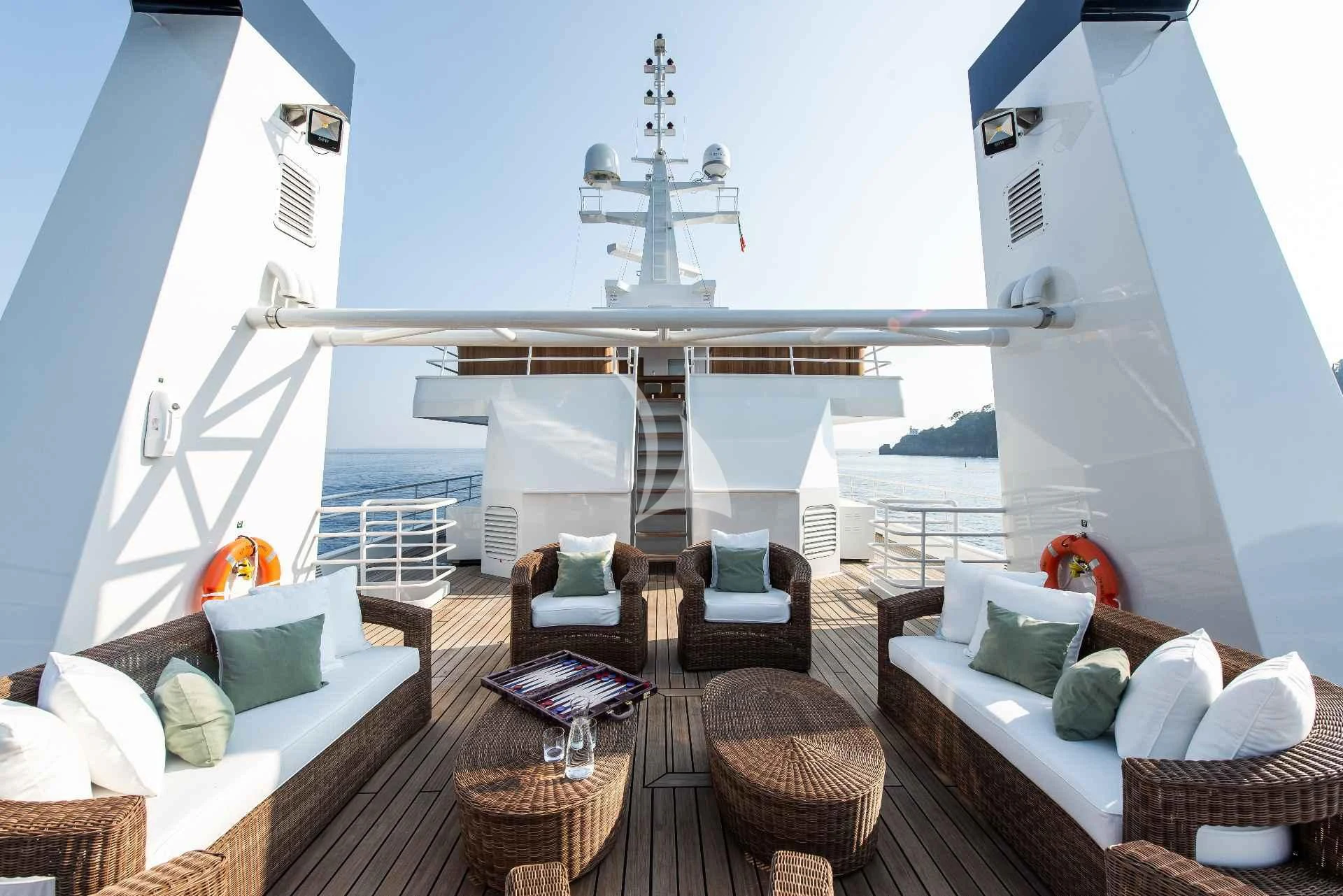 a room with a couch and a table and chairs aboard BLEU DE NIMES Yacht for Charter