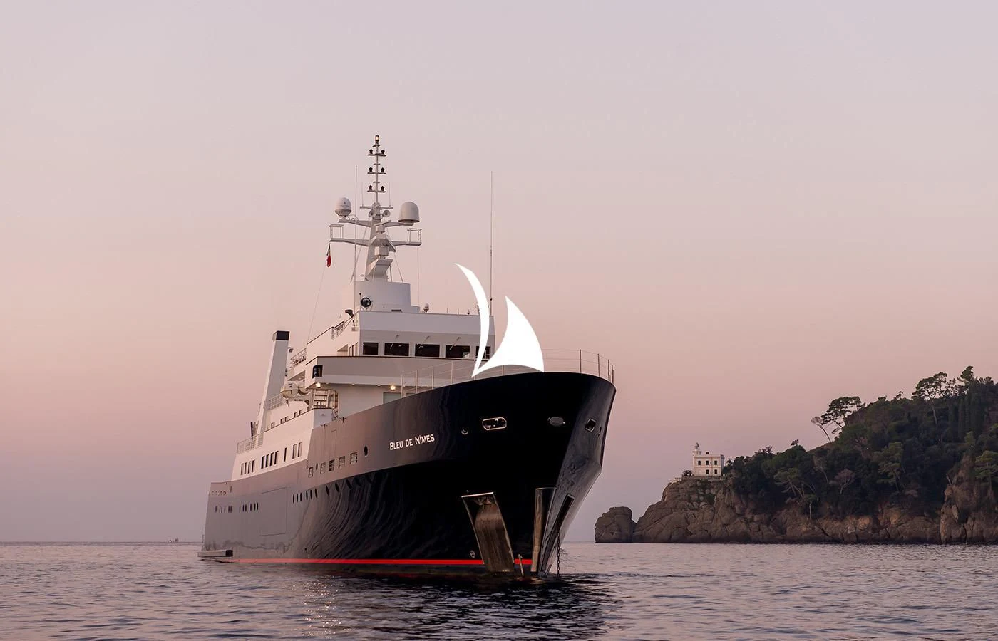 a large ship in the water aboard BLEU DE NIMES Yacht for Charter
