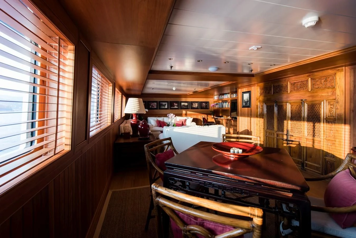 a room with a piano and a piano aboard BLEU DE NIMES Yacht for Charter