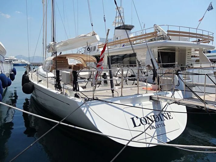 a boat docked in a harbor aboard L'ONDINE Yacht for Sale