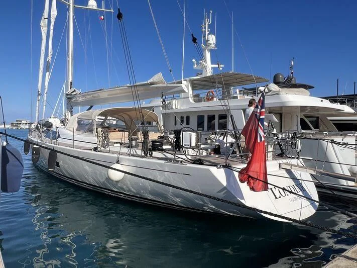 a boat with a red flag on it aboard L'ONDINE Yacht for Sale