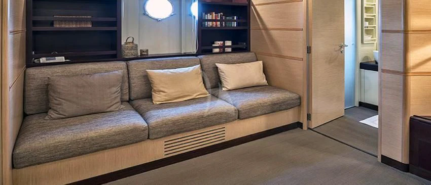 a couch in a room aboard INDIAN Yacht for Sale