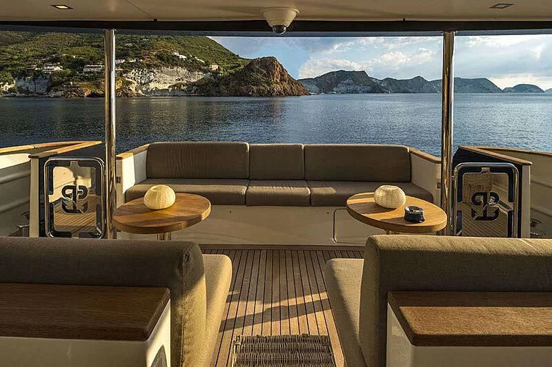 a room with a table and chairs aboard INDIAN Yacht for Sale