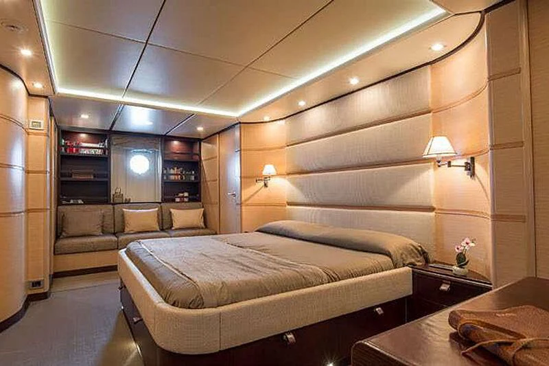 a bedroom with a bed and a couch aboard INDIAN Yacht for Sale