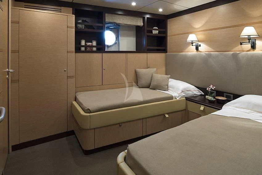 a room with a bed and a desk aboard INDIAN Yacht for Sale