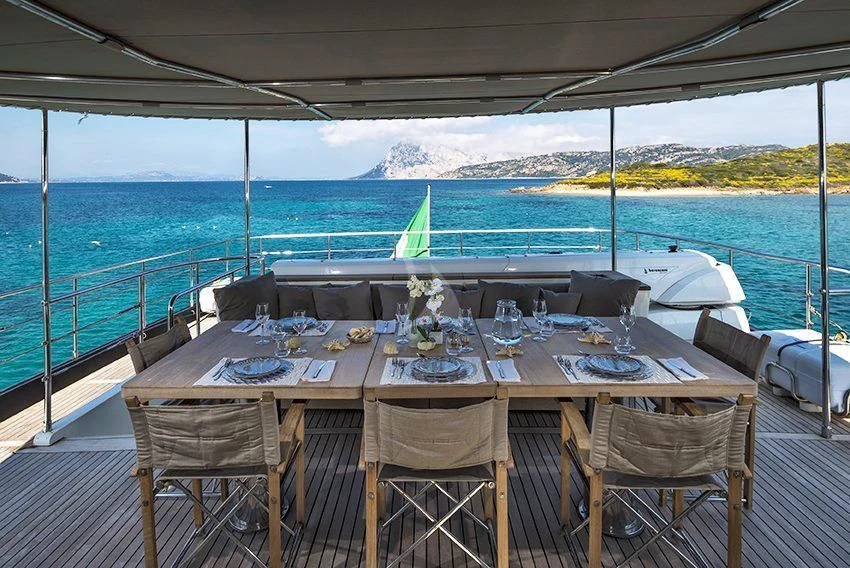 a table set for a dinner on a boat aboard INDIAN Yacht for Sale