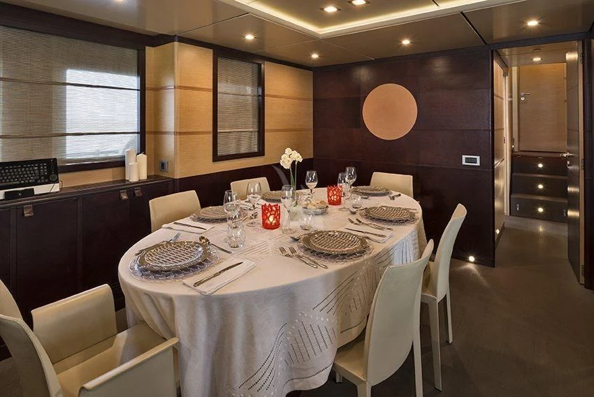 a table set for a dinner aboard INDIAN Yacht for Sale