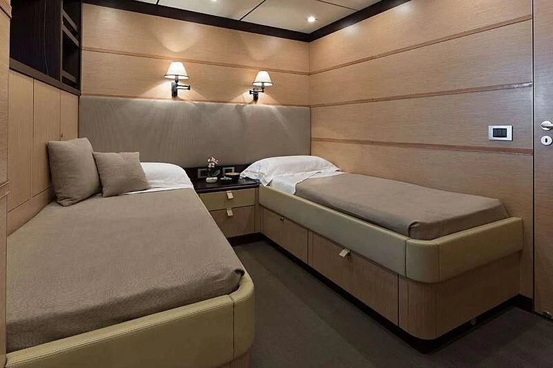 a room with two beds aboard INDIAN Yacht for Sale