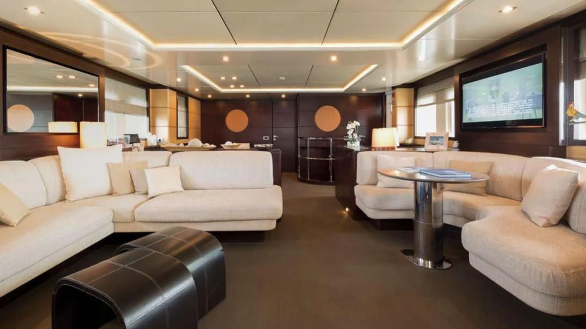 a living room with a large screen aboard INDIAN Yacht for Sale