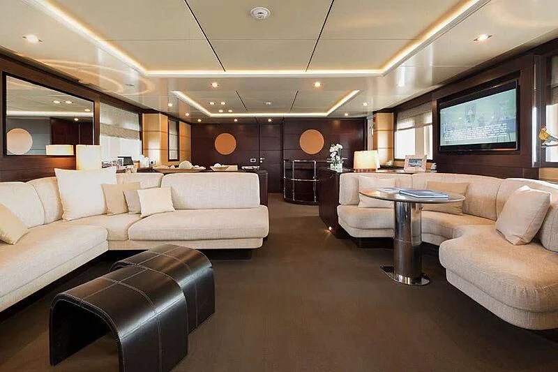 a living room with a large screen aboard INDIAN Yacht for Sale