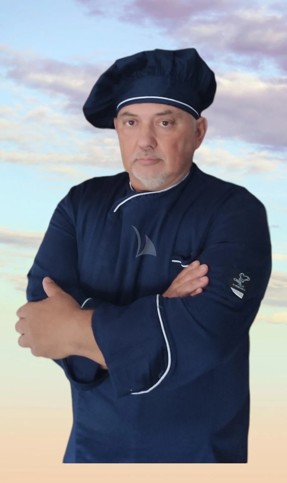 a person wearing a black jacket and hat with a white shirt and black hat aboard INDIAN Yacht for Sale