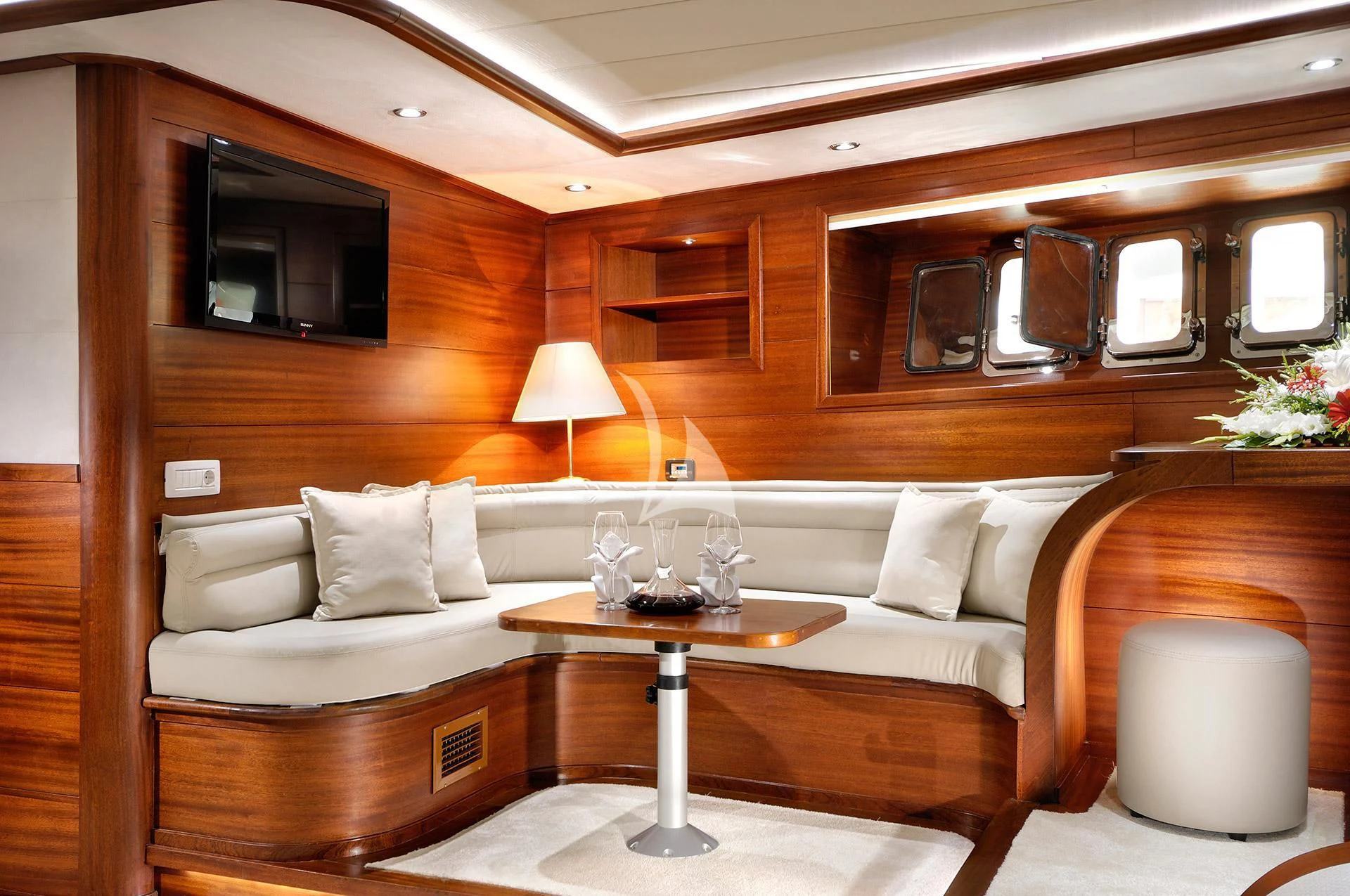 a living room with a couch and a coffee table aboard ALESSANDRO I Yacht for Sale