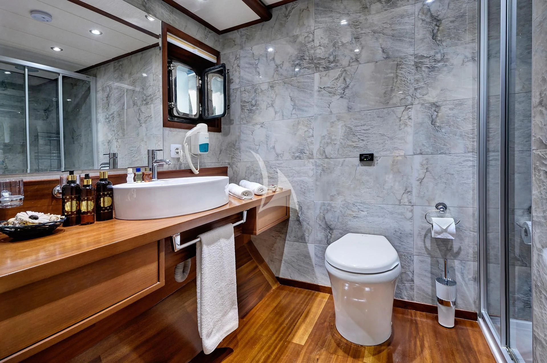 a bathroom with a sink toilet and a mirror aboard ALESSANDRO I Yacht for Sale