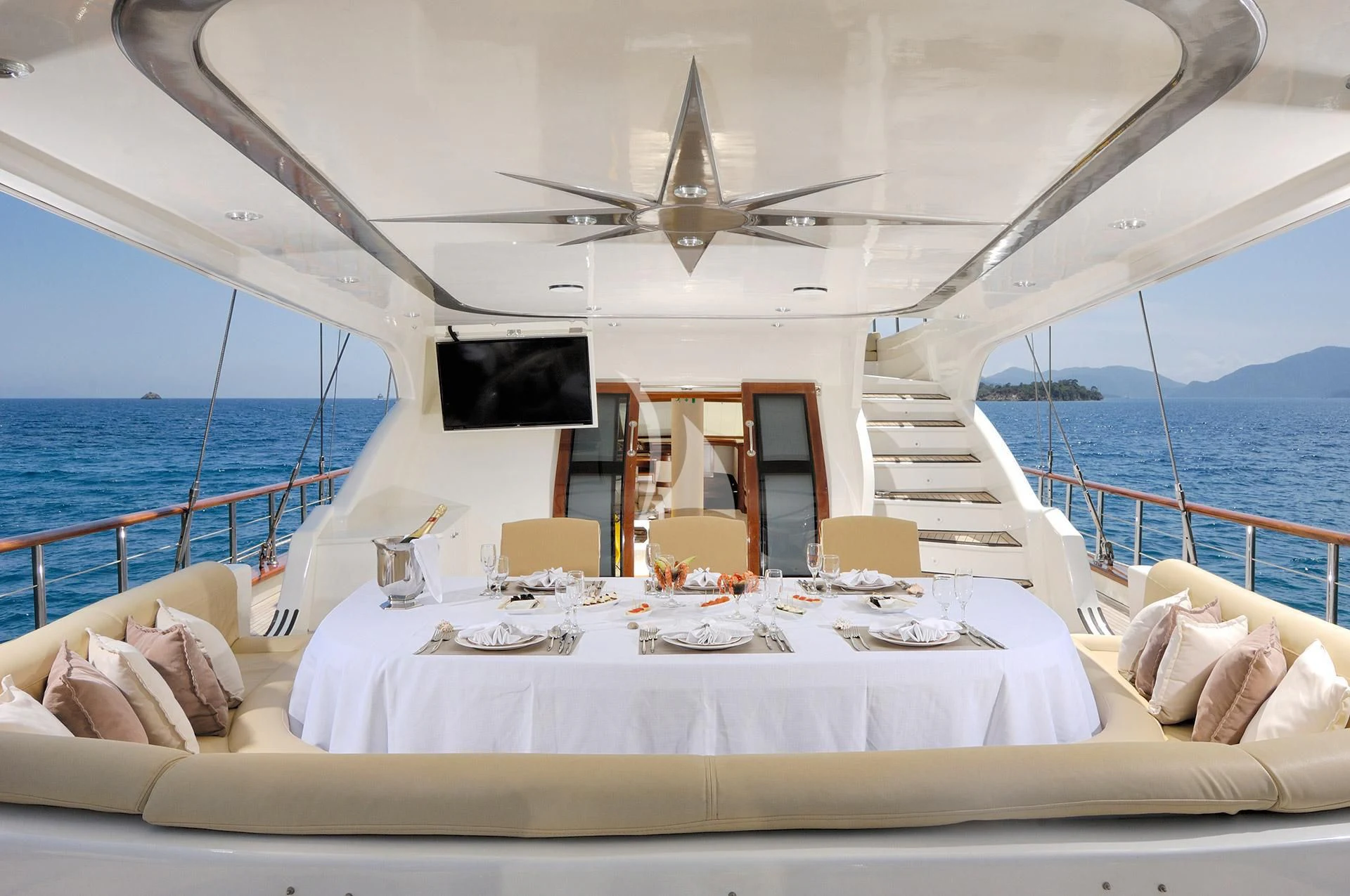 a large white tent with a table and chairs on it aboard ALESSANDRO I Yacht for Sale
