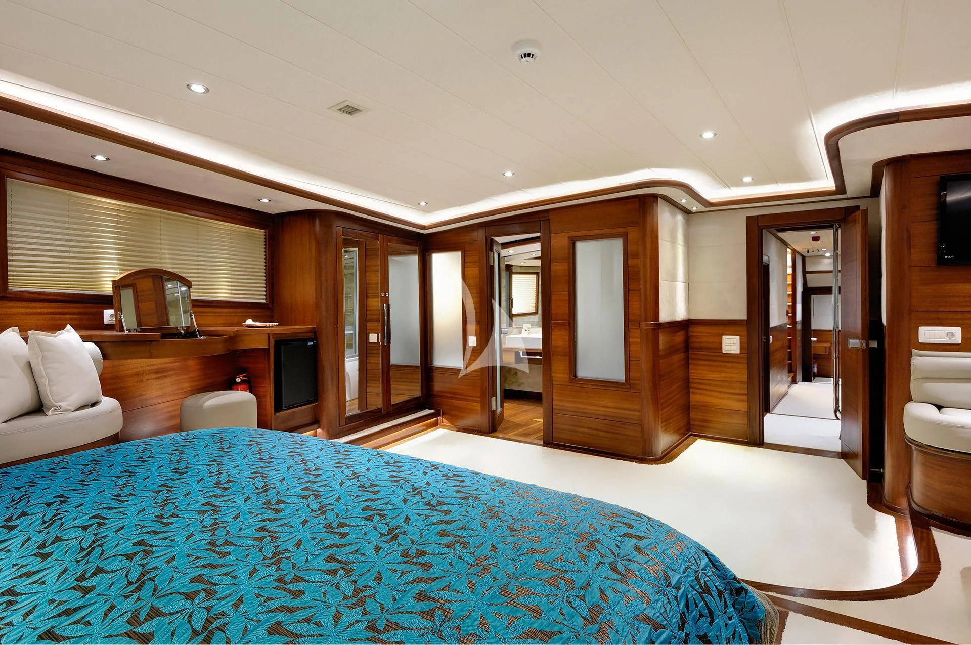 a large hotel room with a large bed and a large blue rug aboard ALESSANDRO I Yacht for Sale