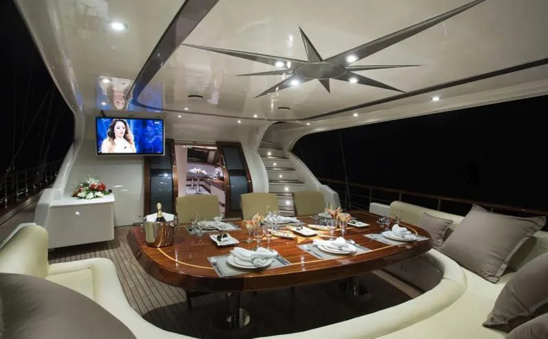 a dining table in a room aboard ALESSANDRO I Yacht for Sale