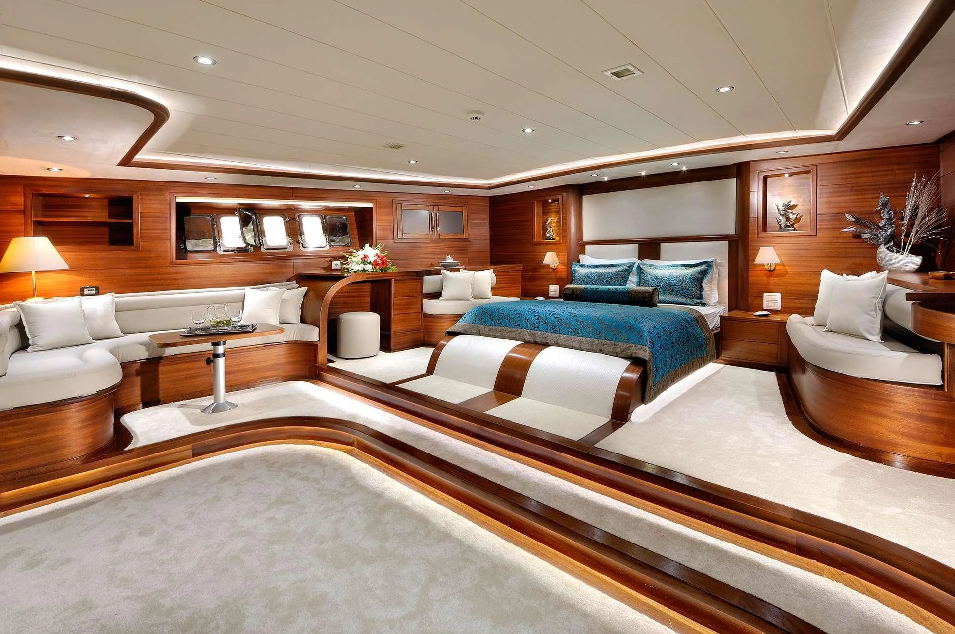 a large living room with a large bed and a couch aboard ALESSANDRO I Yacht for Sale