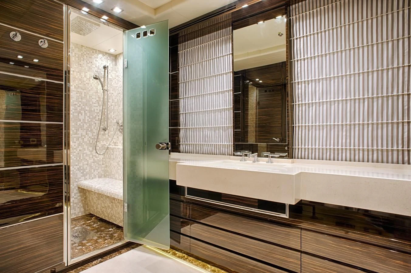 a bathroom with a tub and shower aboard TUTTO LE MARRANE Yacht for Charter