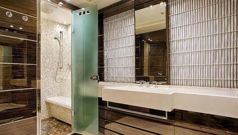 a bathroom with a tub and shower aboard TUTTO LE MARRANE Yacht for Charter