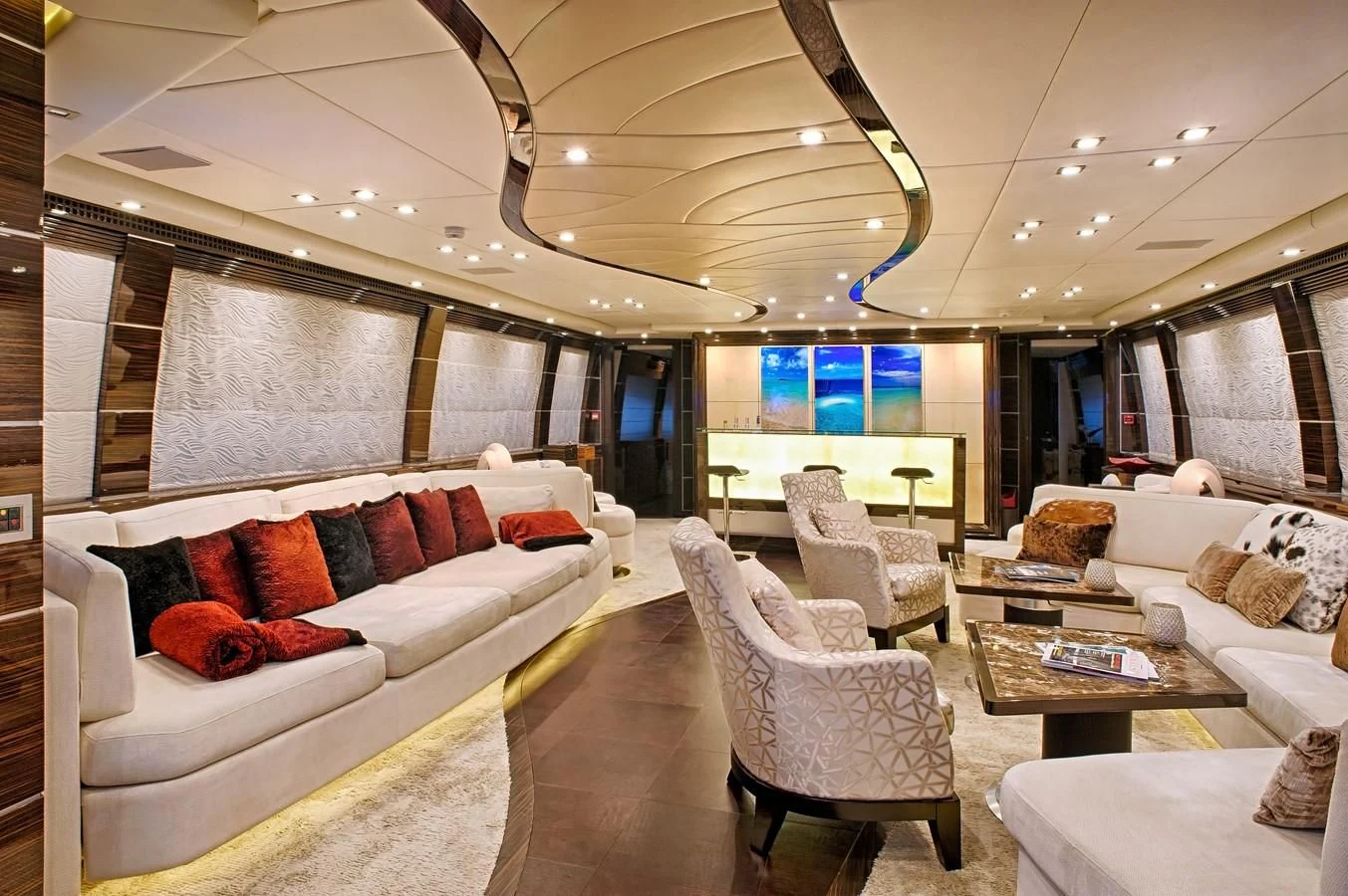 a living room with a couch and a table aboard TUTTO LE MARRANE Yacht for Charter