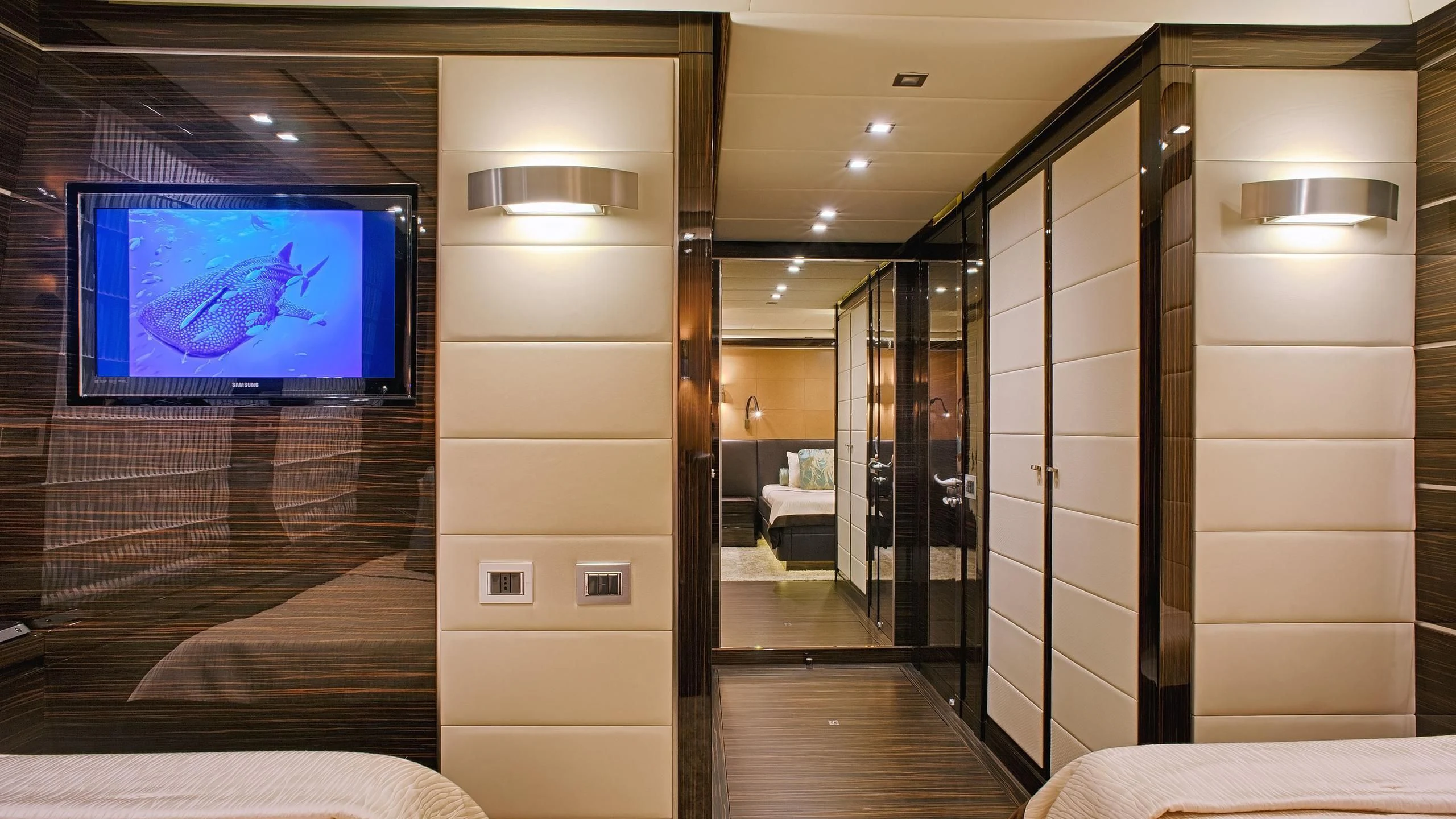 a room with a tv and a bed aboard TUTTO LE MARRANE Yacht for Charter