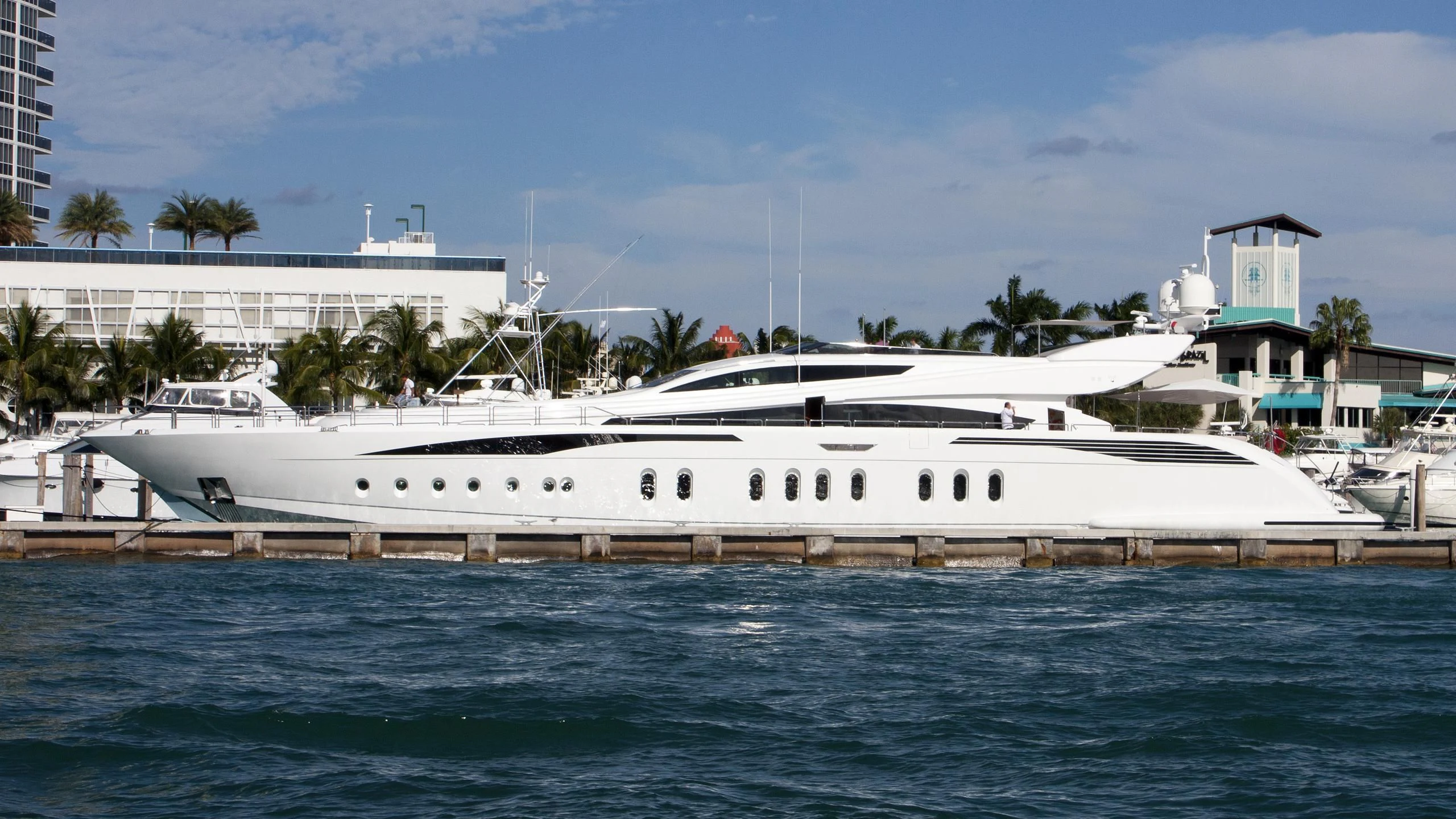 a large white boat in the water aboard TUTTO LE MARRANE Yacht for Charter