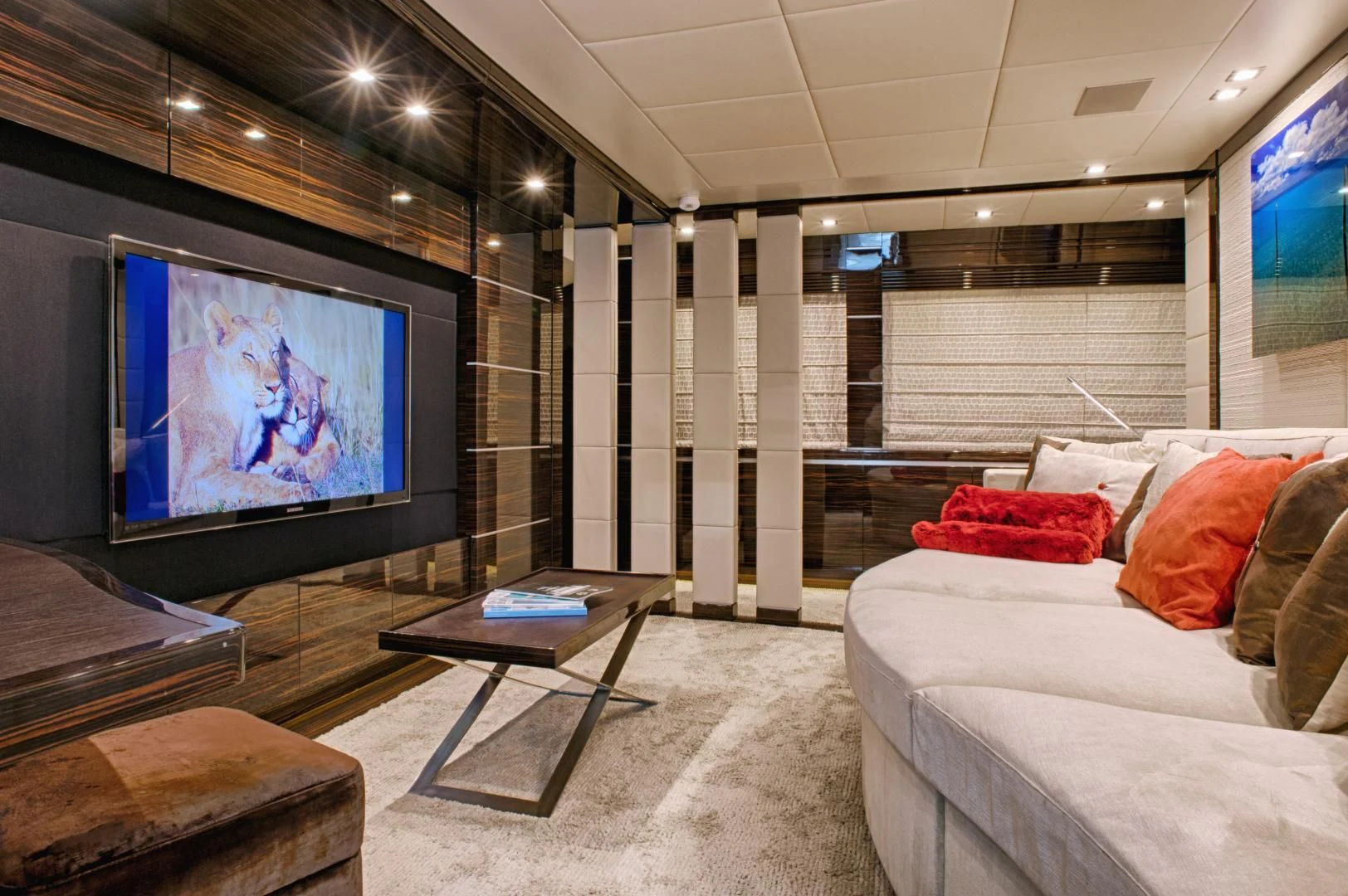 a room with a tv and a bed aboard TUTTO LE MARRANE Yacht for Charter