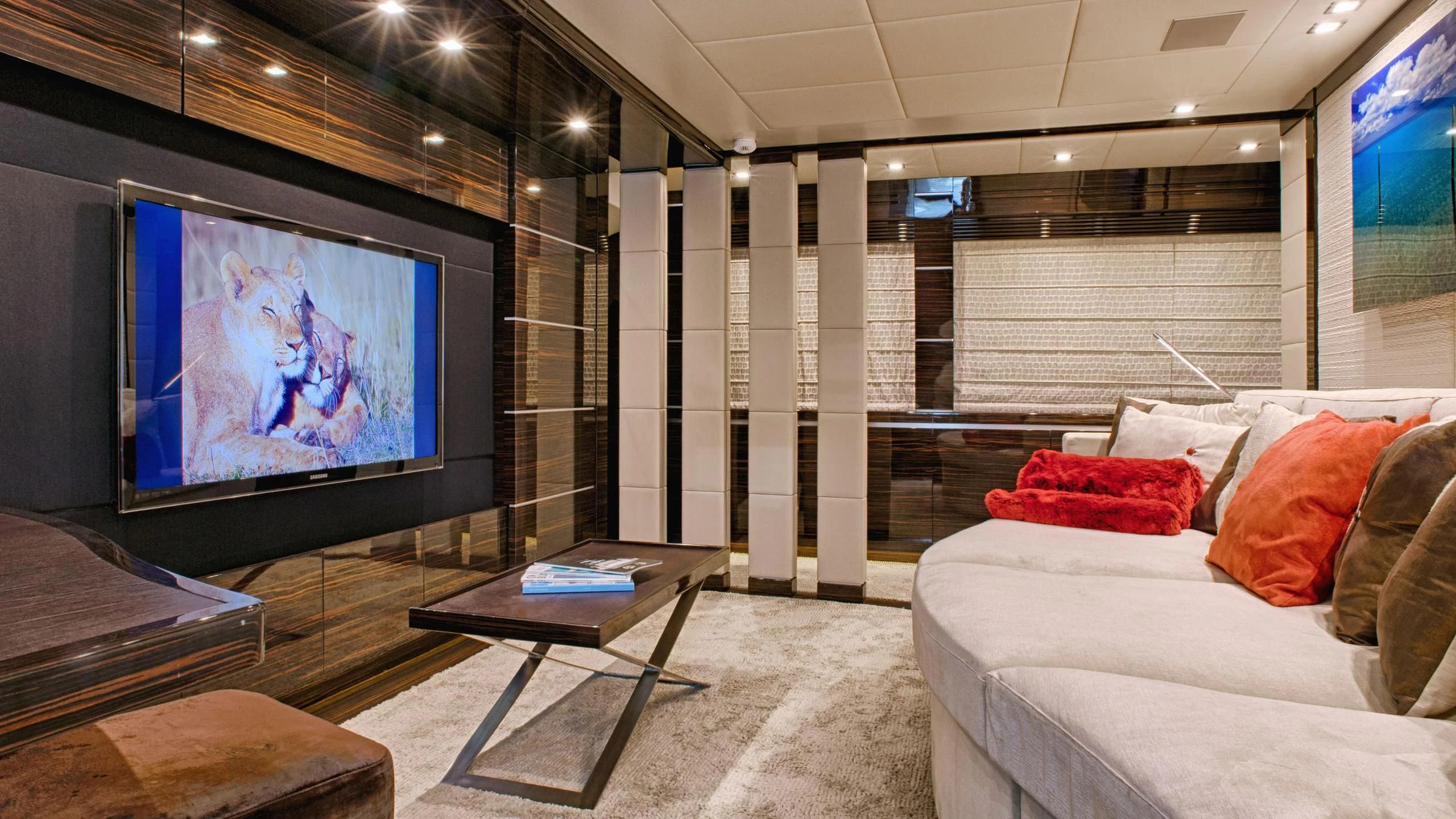 a room with a tv and a bed aboard TUTTO LE MARRANE Yacht for Charter