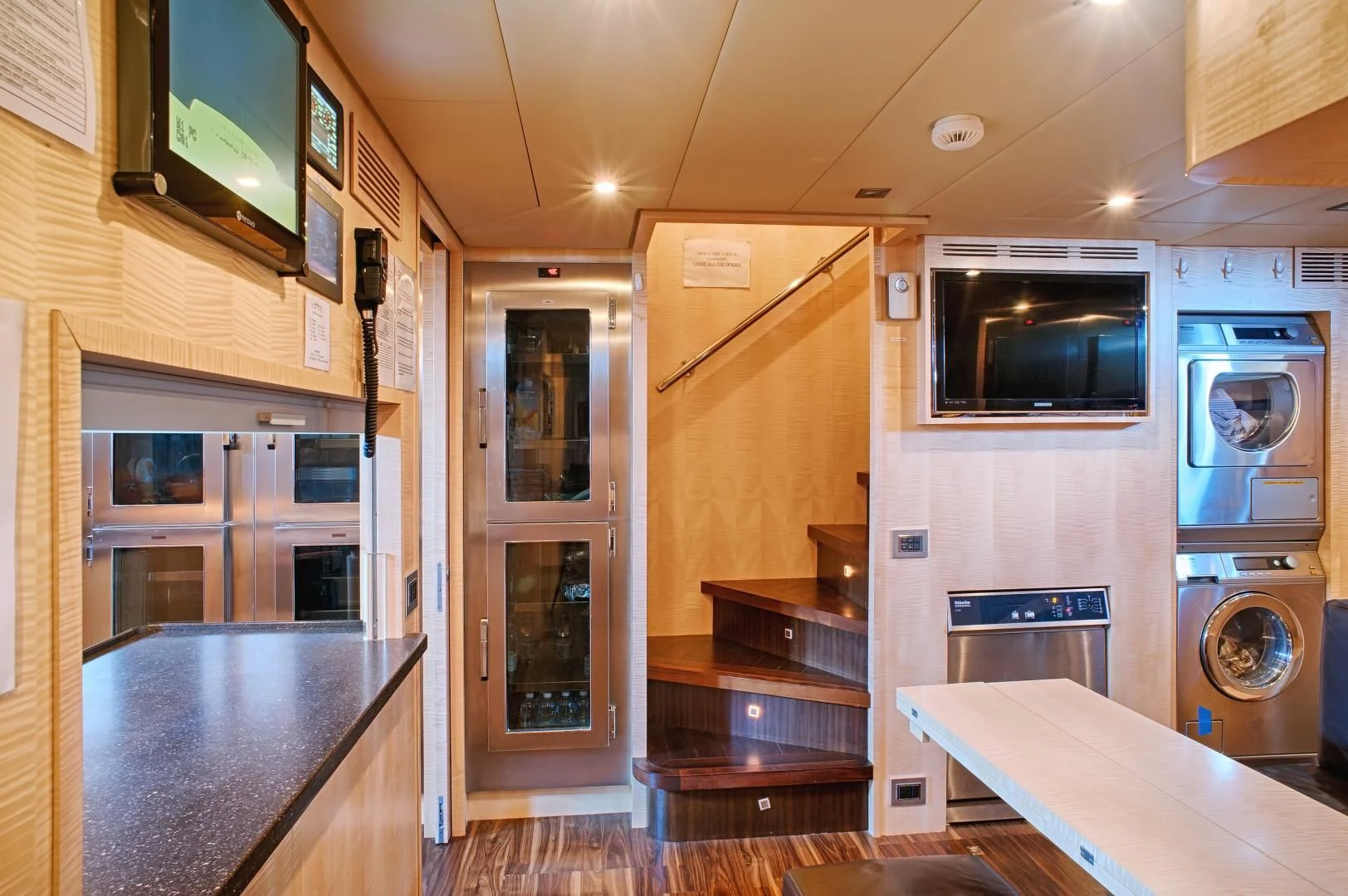 a kitchen with a microwave oven and oven aboard TUTTO LE MARRANE Yacht for Charter
