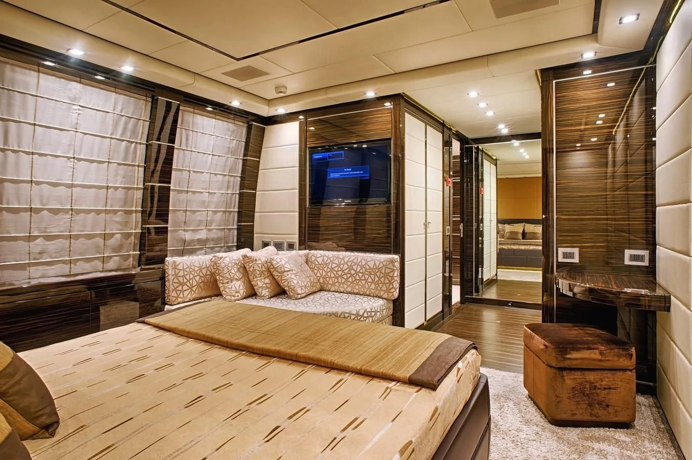 a large room with a bed and a couch aboard TUTTO LE MARRANE Yacht for Charter
