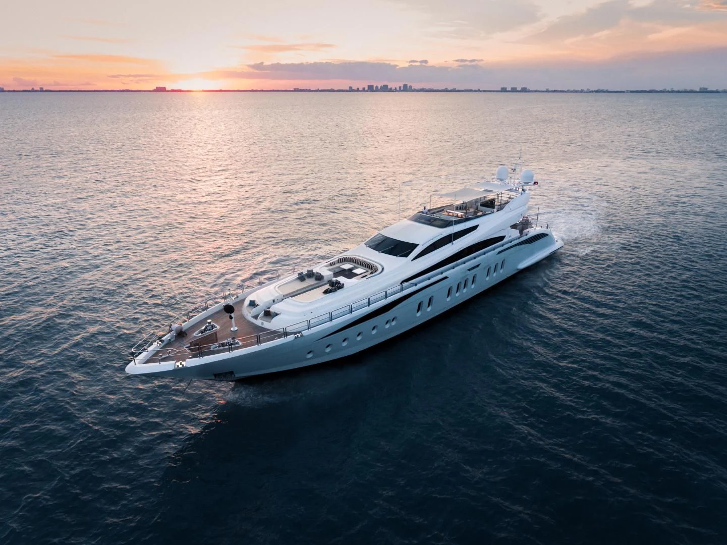 a white yacht in the water aboard TUTTO LE MARRANE Yacht for Charter
