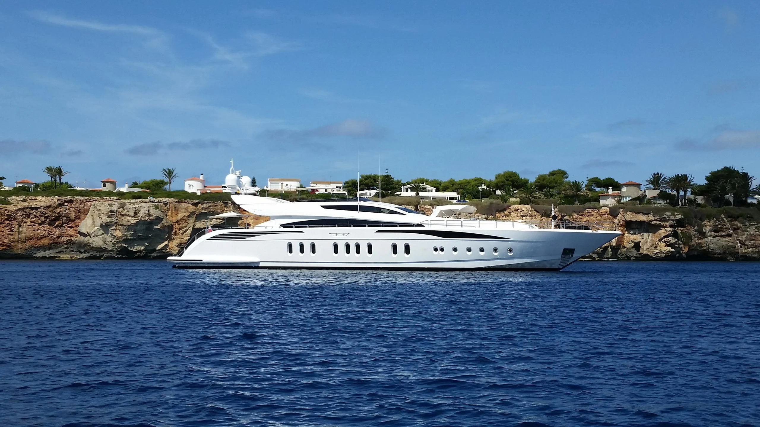 a white boat in the water aboard TUTTO LE MARRANE Yacht for Charter