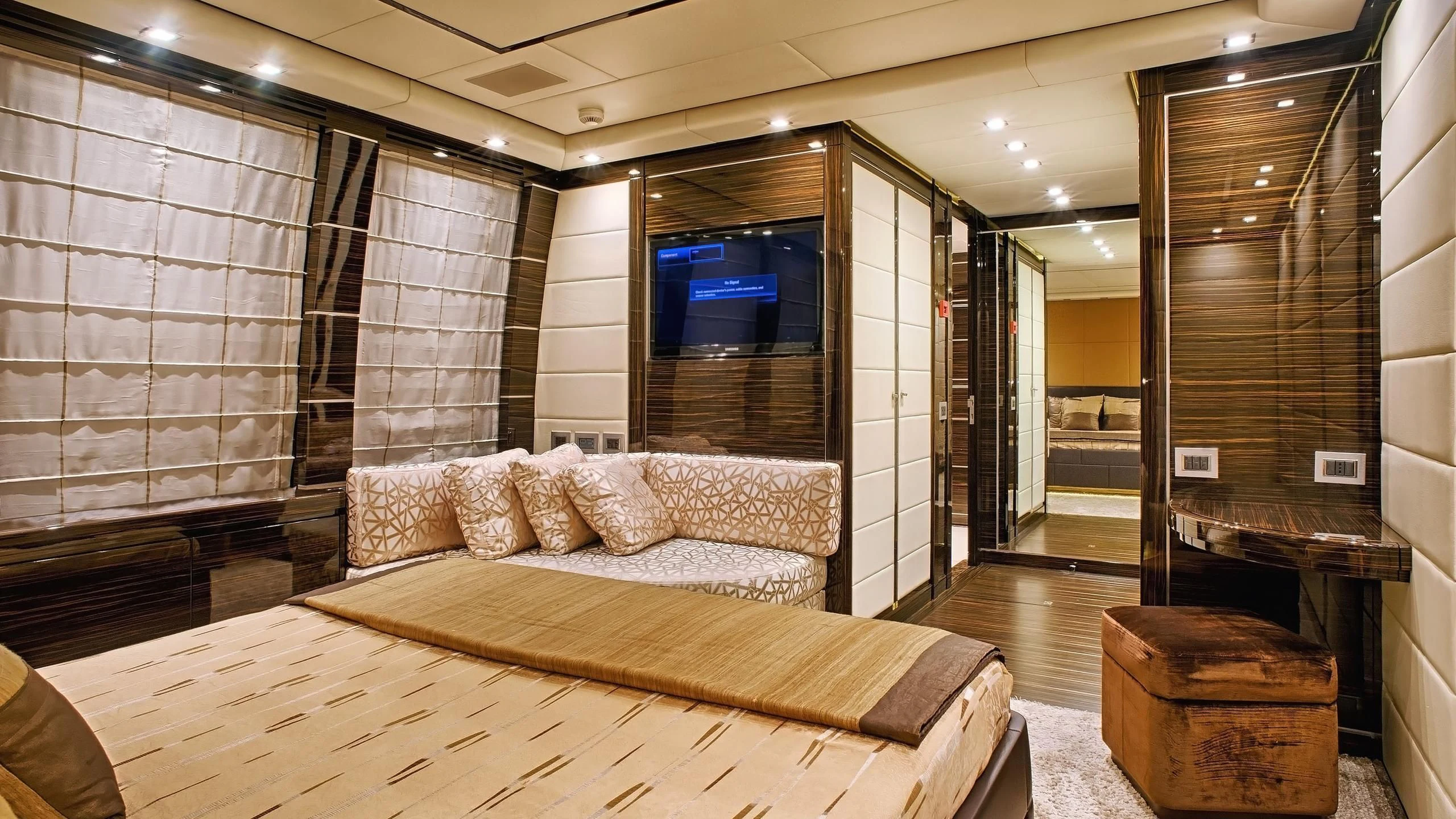 a room with a bed and a couch aboard TUTTO LE MARRANE Yacht for Charter