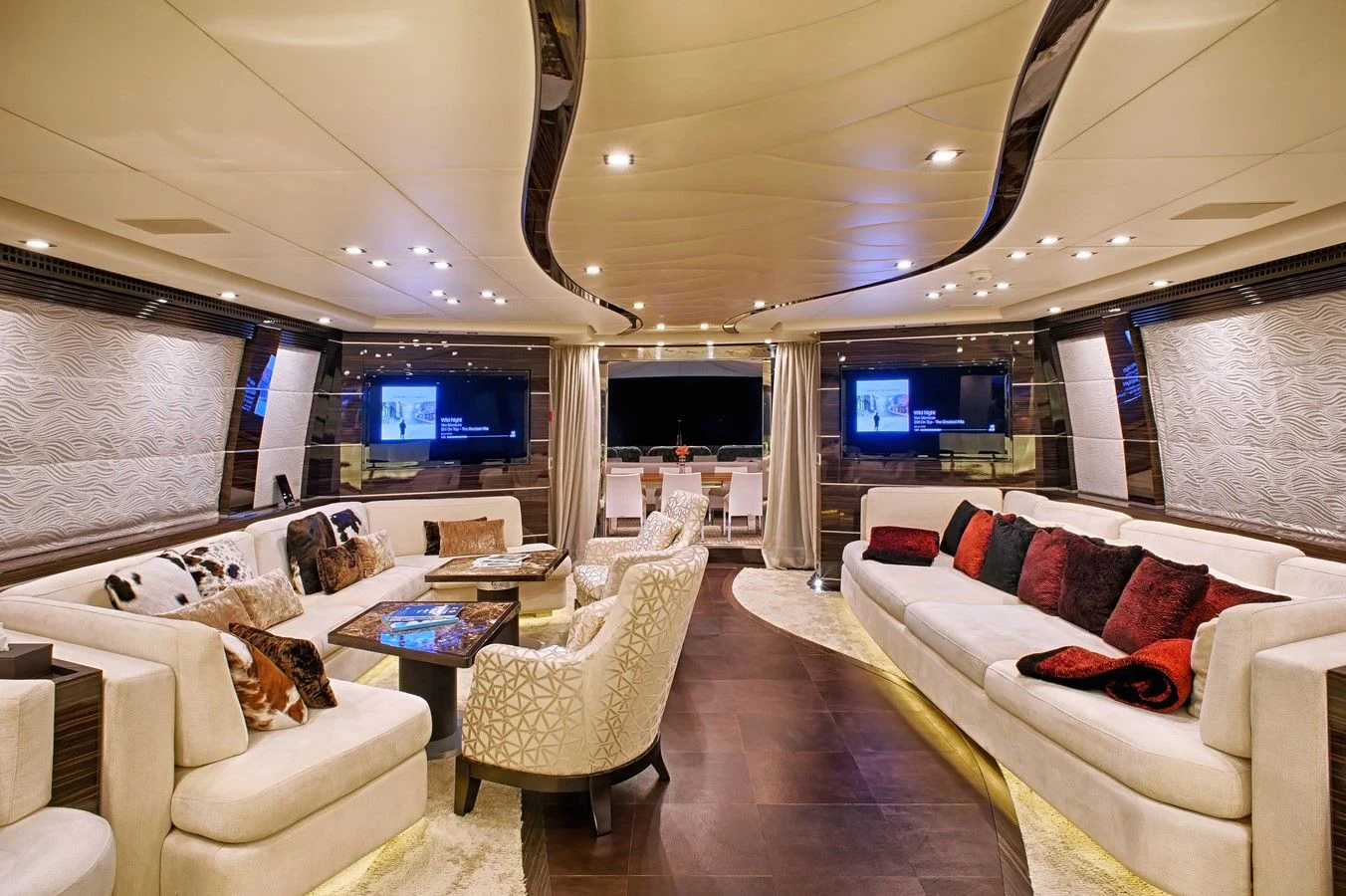 a living room with a large screen aboard TUTTO LE MARRANE Yacht for Charter