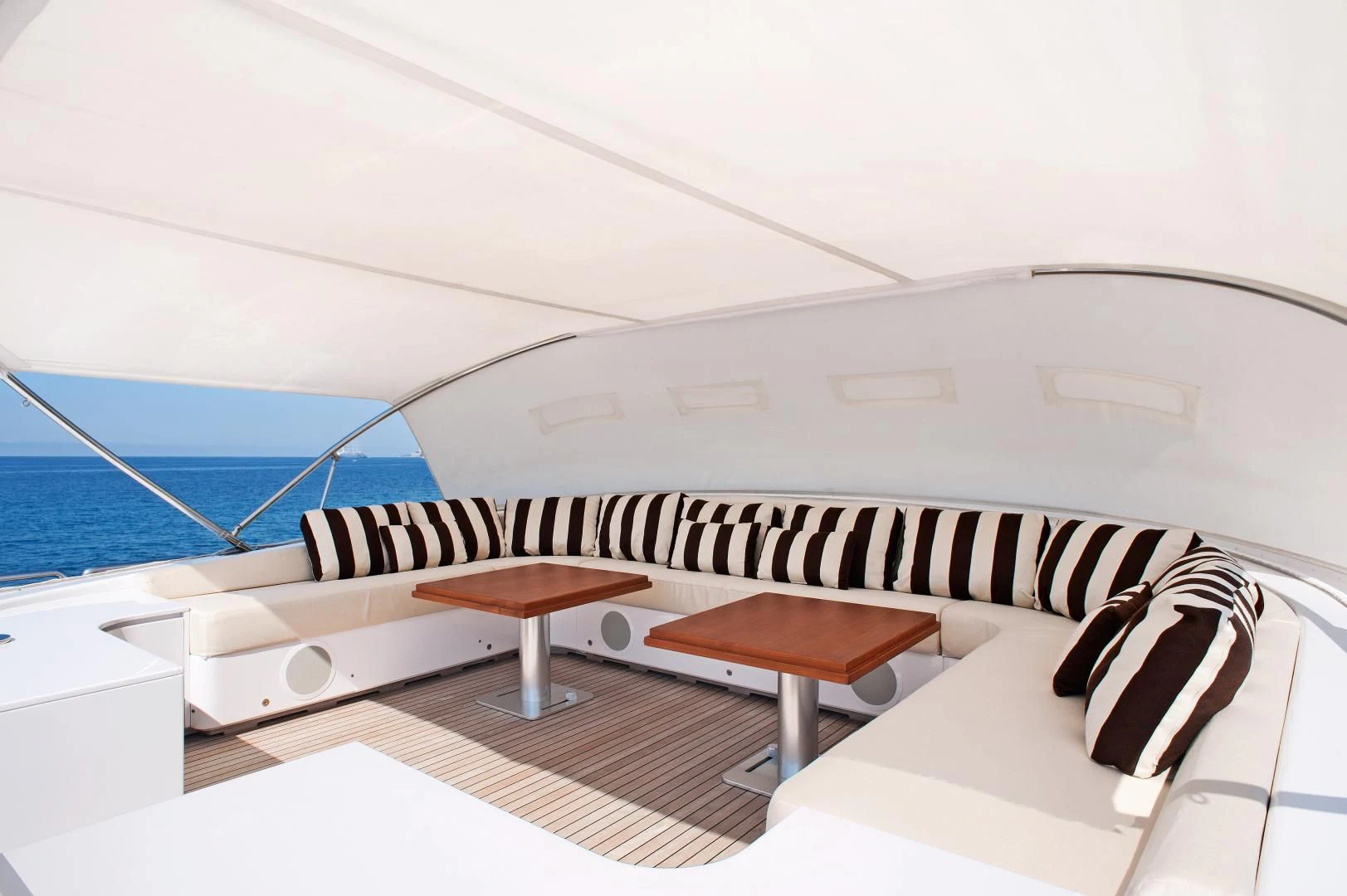 a room with a bed and a table aboard TUTTO LE MARRANE Yacht for Charter