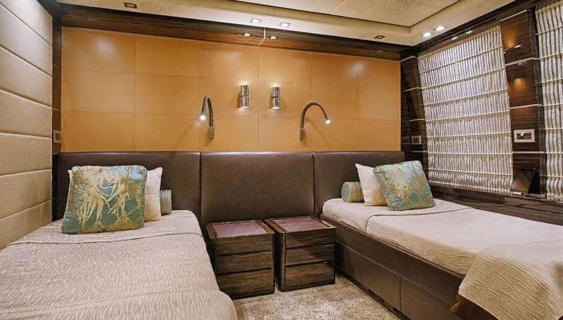 a room with two beds aboard TUTTO LE MARRANE Yacht for Charter