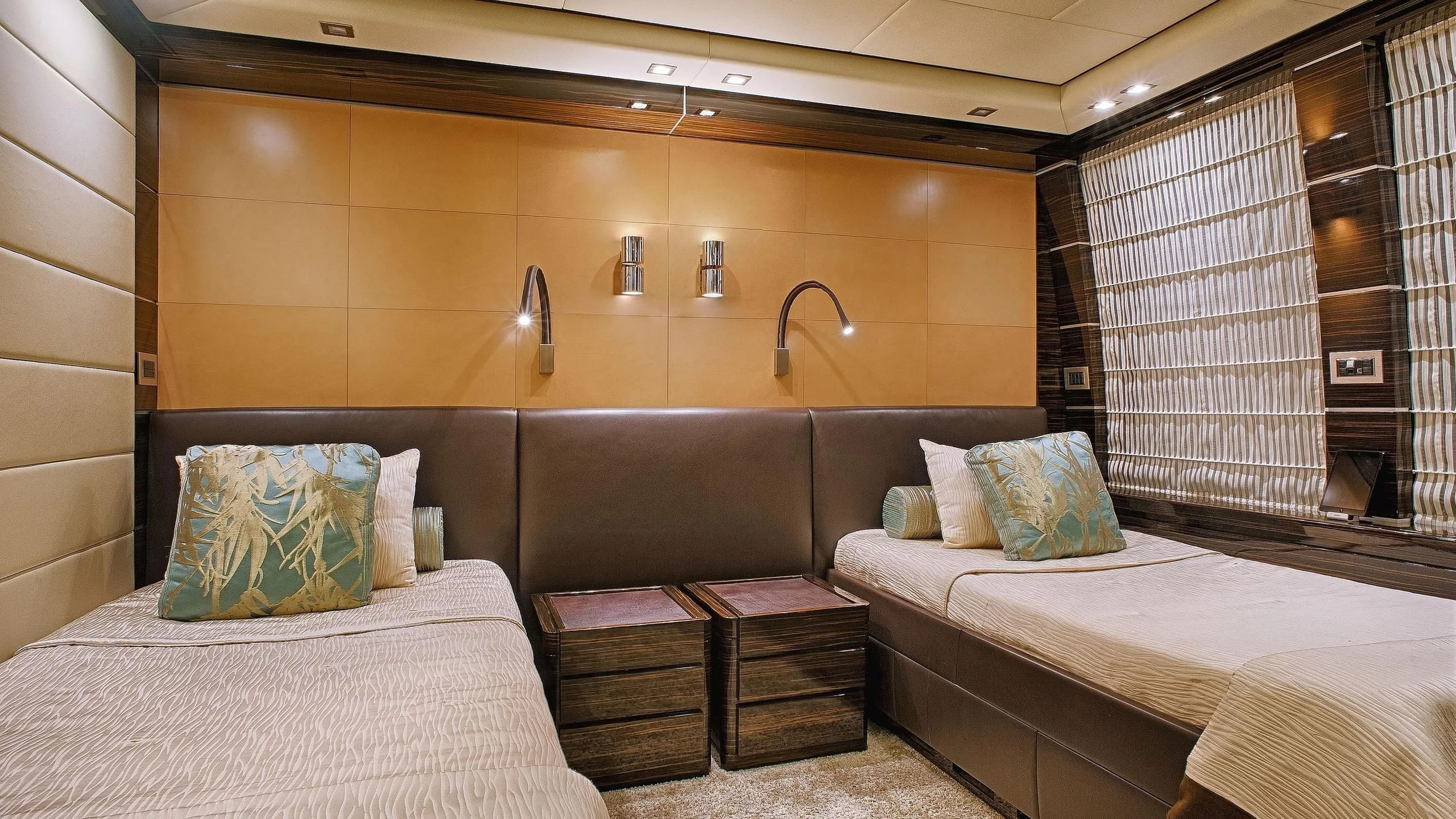 a room with a couple of beds aboard TUTTO LE MARRANE Yacht for Charter
