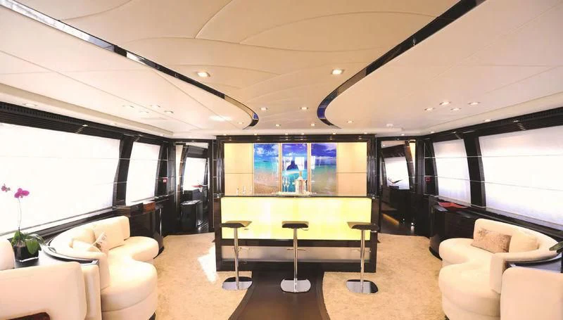 a room with a table and chairs aboard TUTTO LE MARRANE Yacht for Charter