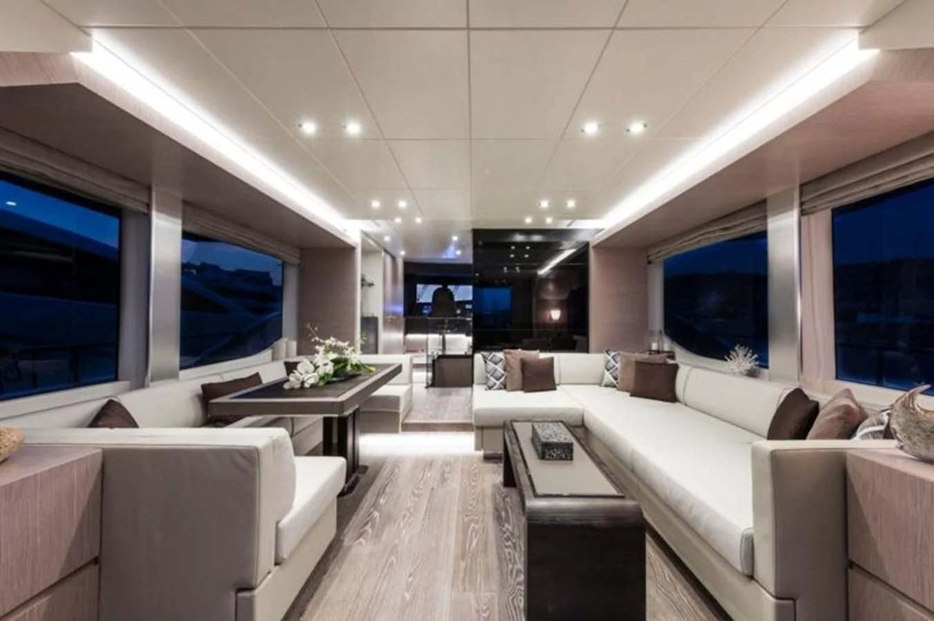 a room with a couch and a table aboard BULL Yacht for Sale