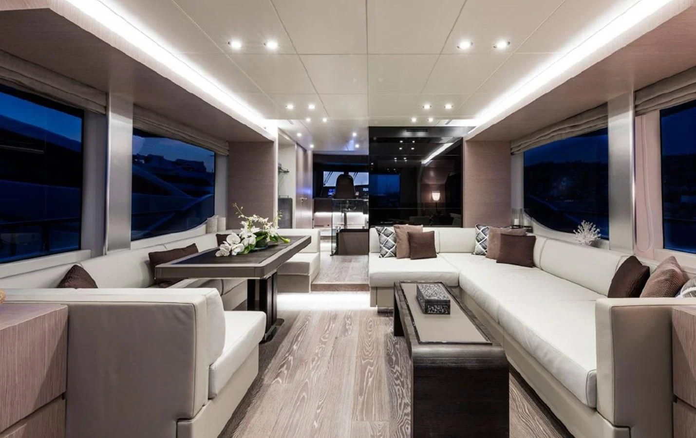 a living room with a large screen aboard BULL Yacht for Sale